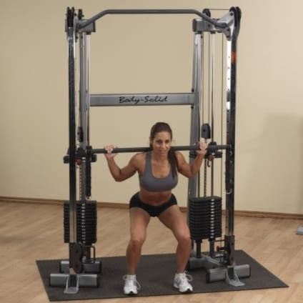 Woman using the weight stack on the GDCC210 By Body Solid