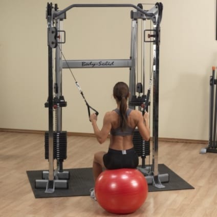 Woman Using A Gym Ball With Cables On The Body Solid GDCC210 In This Review